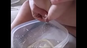 Wife giving her breast milk drinking